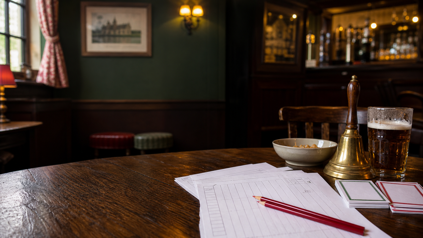 A British pub table set up with quiz sheets, pencils, and a brass bell